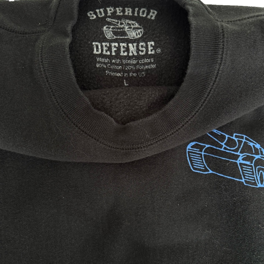 Forward ObservationSuperior Defense Black Sweatshirt with Blue Graphic